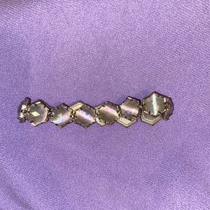 Kendra Scott silver bracelet.